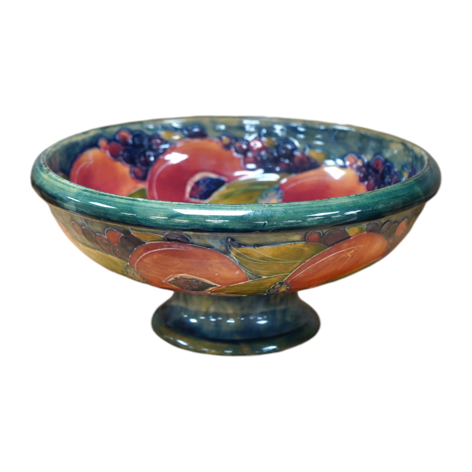 An early Moorcroft pomegranate pattern footed bowl, diameter 23cm.